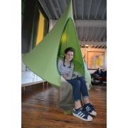 Girl sitting in a green Cacoon Bebo indoors