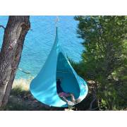 Turquoise Cacoon single by the coast, side view