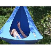 Person lying in a blue Cacoon single under trees