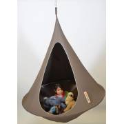 Child with toys inside a taupe Cacoon single, on white