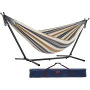Beige and grey striped cotton hammock on a black steel stand with its carry bag, on white