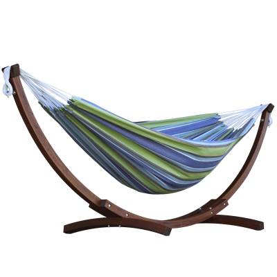 Blue and green striped cotton hammock on a dark wood arc stand, on white