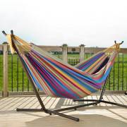 Mixed bright colours hammock on its steel stand on a deck