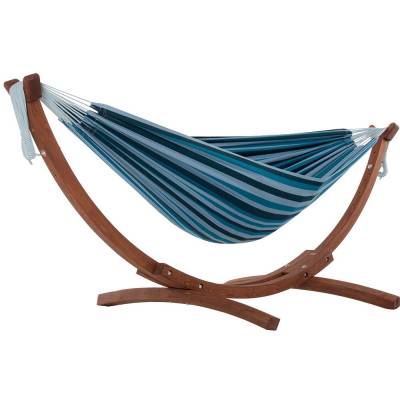 Mixed blues cotton hammock on a dark wood arc stand, on white