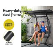 Two people sitting in the grey two seater egg chair, with the 200kg capacity and powder coated steel frame noted