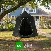 Cocoon tent swing hanging from a tree branch, with a label reading holds up to 150kg