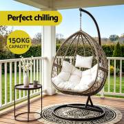 Latte rattan egg chair on a verandah, with the 150kg capacity noted