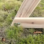Close-up of a timber leg joint at ground level