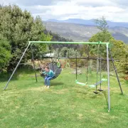 Child in the nest swing, with the whole frame in view