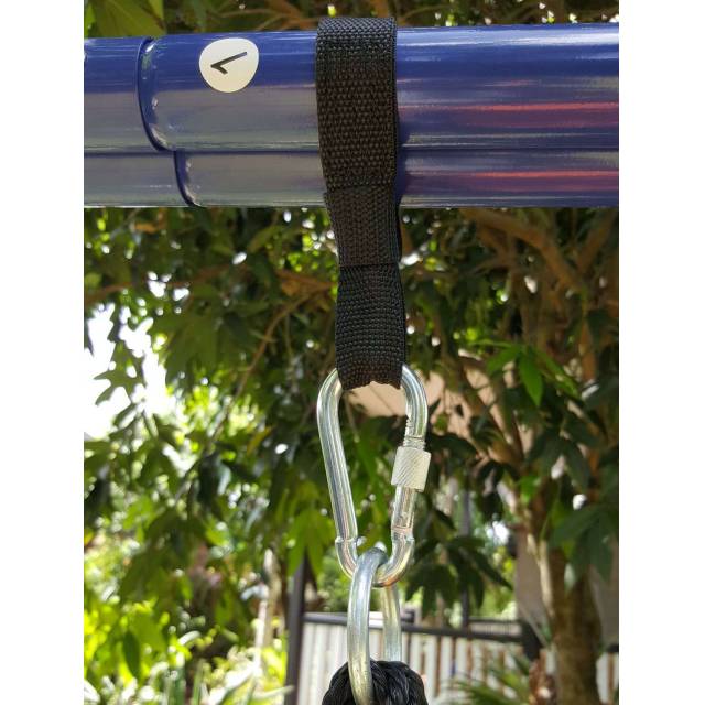 Mini strap looped over the swing set stand bar with a carabiner