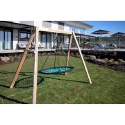 Timber web swing set on a lawn in front of a house with a deck