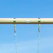 Two swing hangers clamped around the timber top beam, each with a snap hook holding a chain