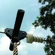 Trolley handlebar and the white stopper of the spring brake on the cable, seen from below